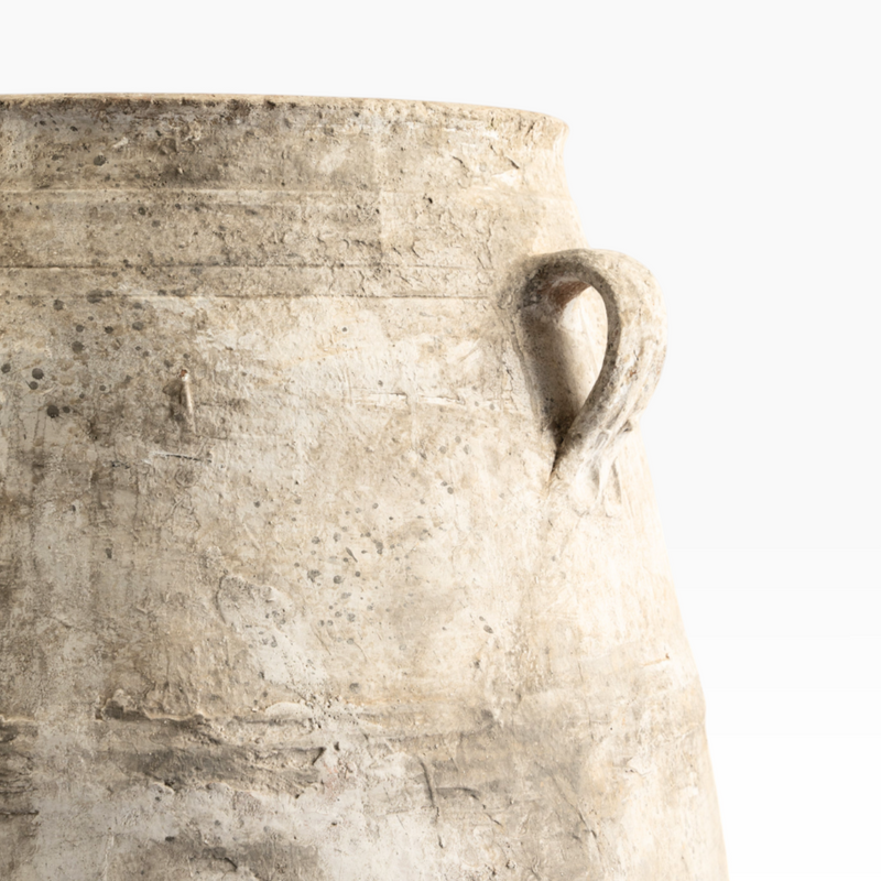 The Well by BDAntiques antique terracotta olive jar with a weathered finish and side handle on a white background