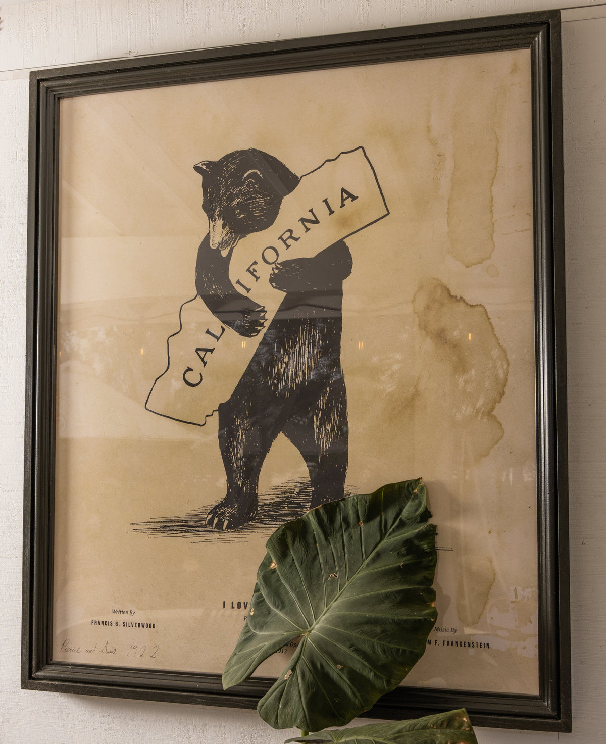 The Well by BDAntiques framed vintage-style California bear print featuring a black bear holding a state map outline.