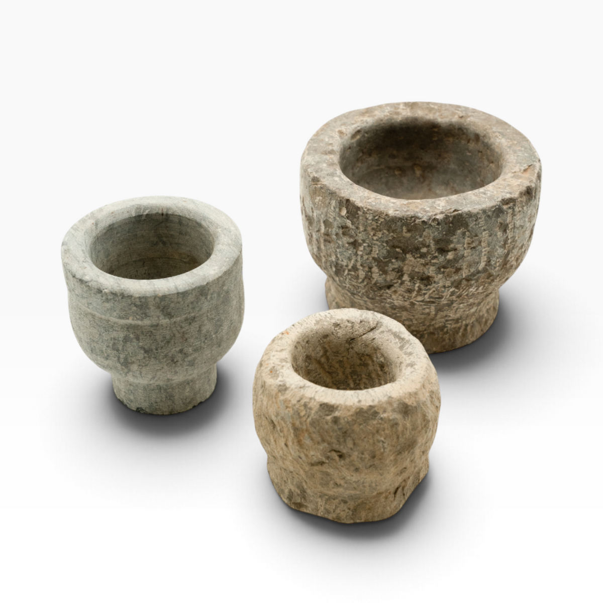 Three The Well by BDAntiques handcrafted stone bowl planters with unique textures and rustic carved designs.