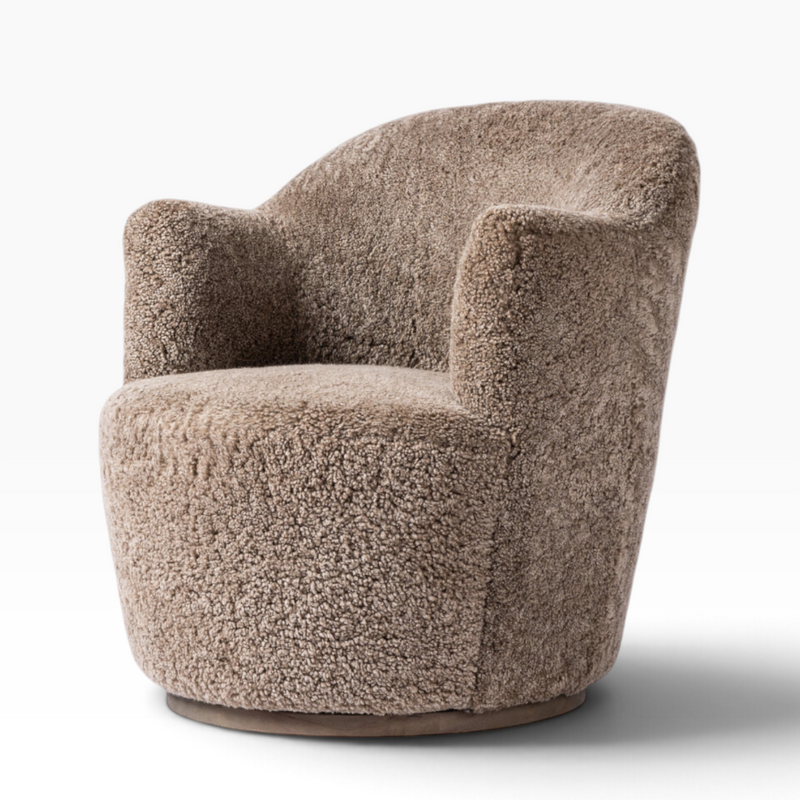 The Well by BDAntiques Korbin swivel chair in distressed natural shearling with a plush, cozy, rounded design.