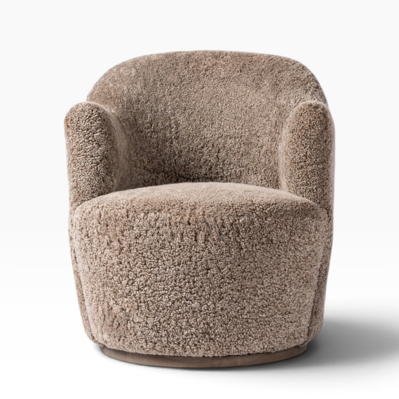 The Well by BDAntiques Korbin swivel chair in distressed natural shearling with a plush, rounded design.