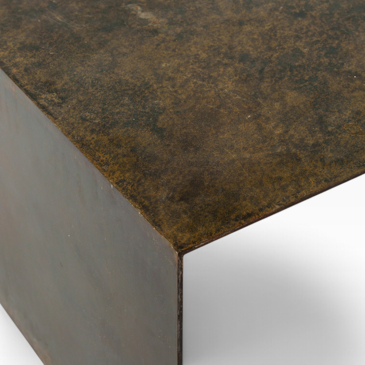 The Well by BDAntiques custom metal waterfall coffee table featuring a dark, weathered industrial finish.