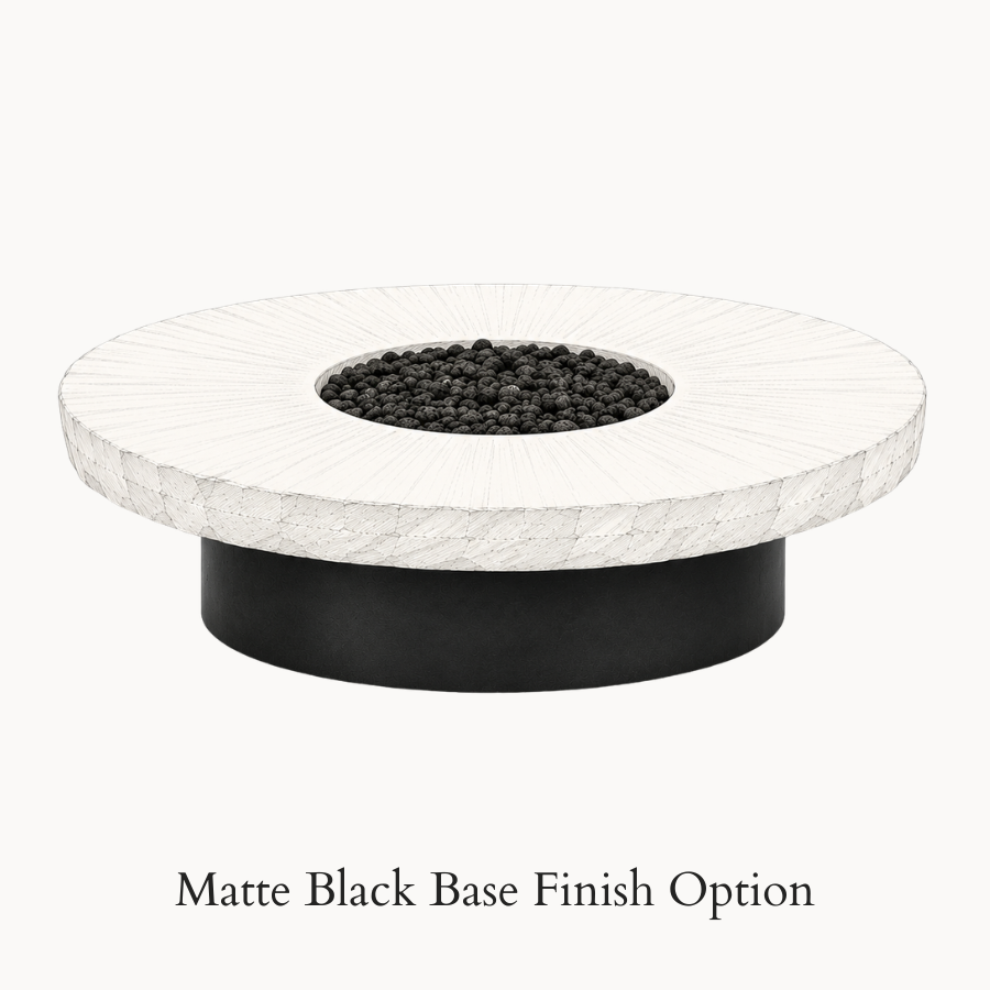 The Well by BDAntiques vintage millstone fire pit with a circular white stone top and a matte black metal base.