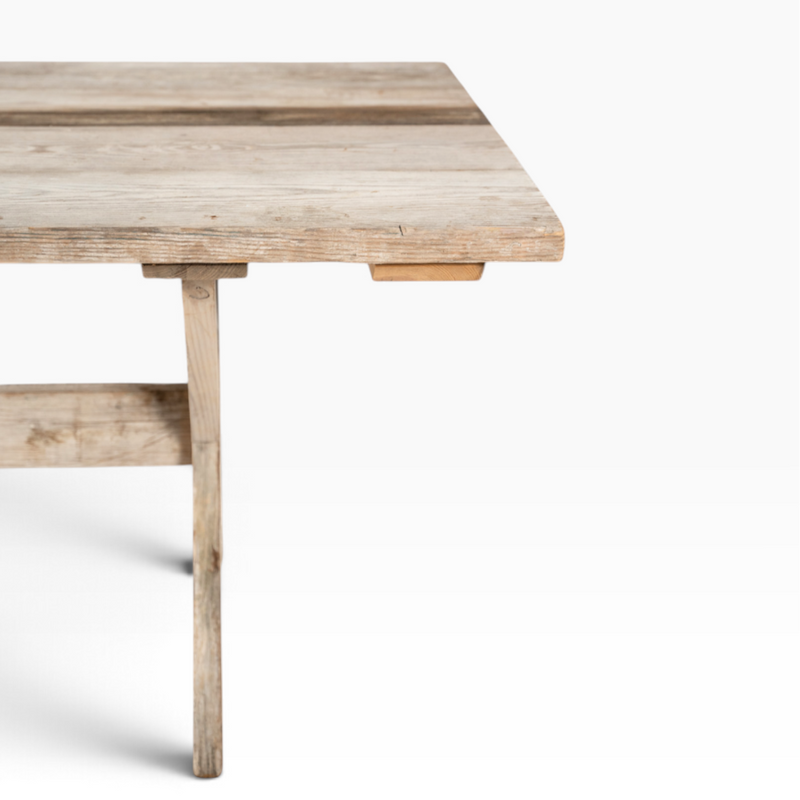 The Well by BDAntiques custom scaffolding dining table featuring a rustic reclaimed wood surface and sturdy frame.