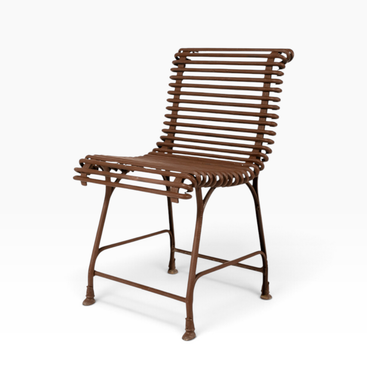 The Well by BDAntiques rust-colored metal outdoor chair with a sculptural, open-frame design made from curved iron rods.