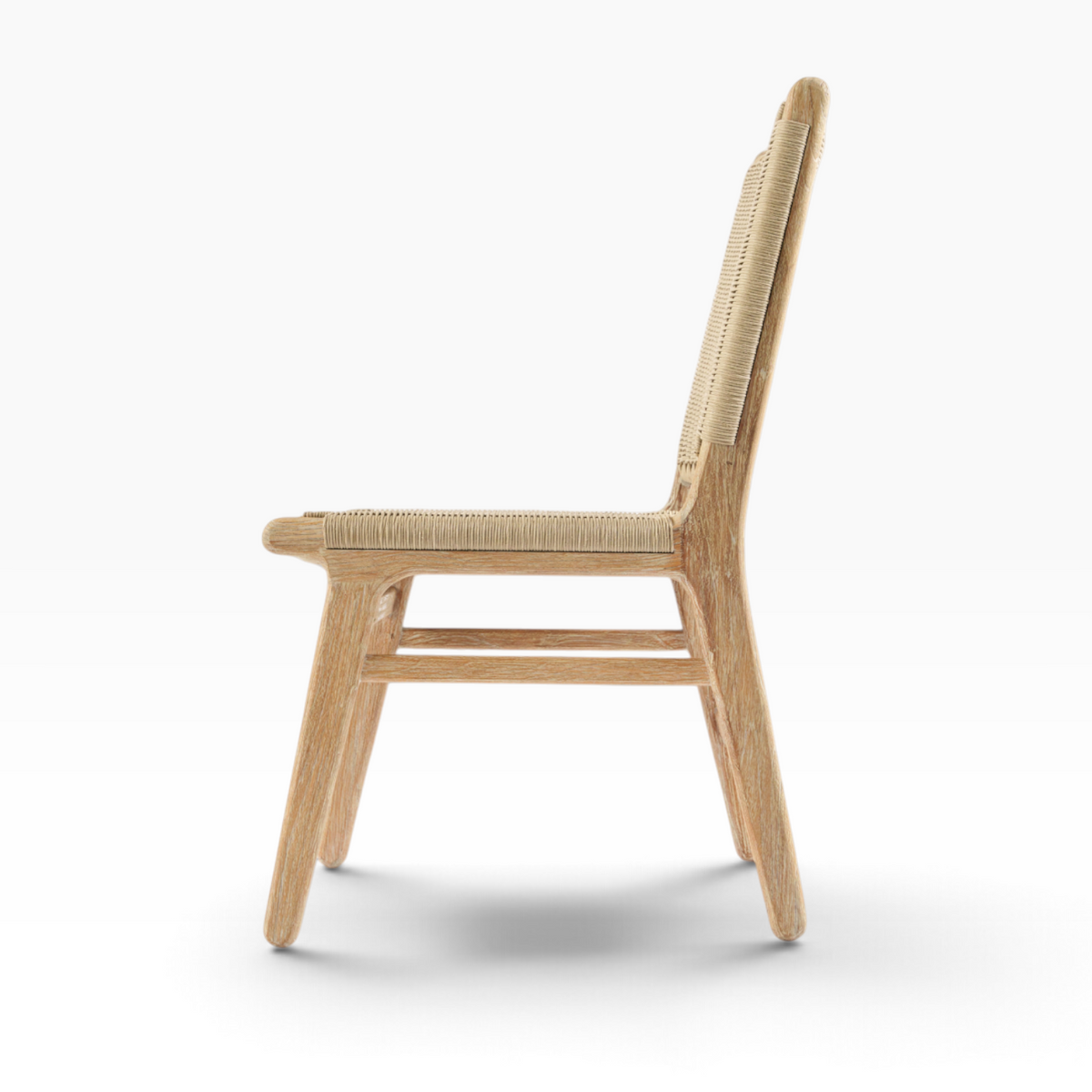 The Well by BDAntiques Sedona outdoor dining chair in natural teak wood with a woven resin wicker back, side view.