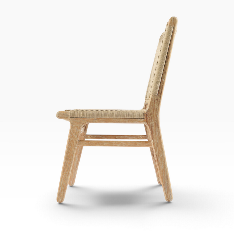 The Well by BDAntiques Sedona outdoor dining chair in natural teak wood with a woven resin wicker back, side view.