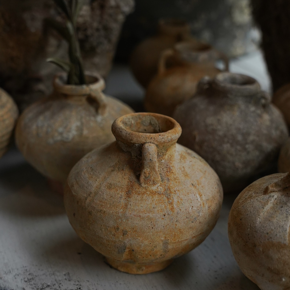 The Well by BDAntiques collection of antique shipwreck pottery vases with weathered textures and natural patina.