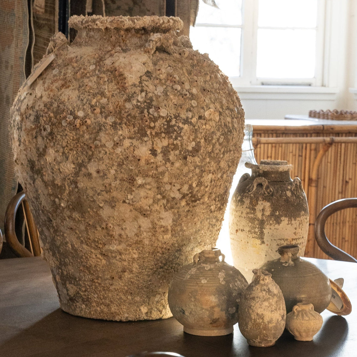 The Well by BDAntiques collection of antique shipwreck pottery vases with weathered textures and marine encrustations.