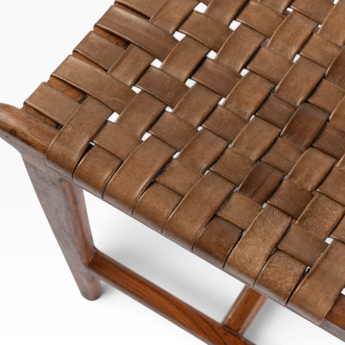 The Well by BDAntiques dining chair featuring a dark wood frame and handwoven brown leather seat in a basket weave.