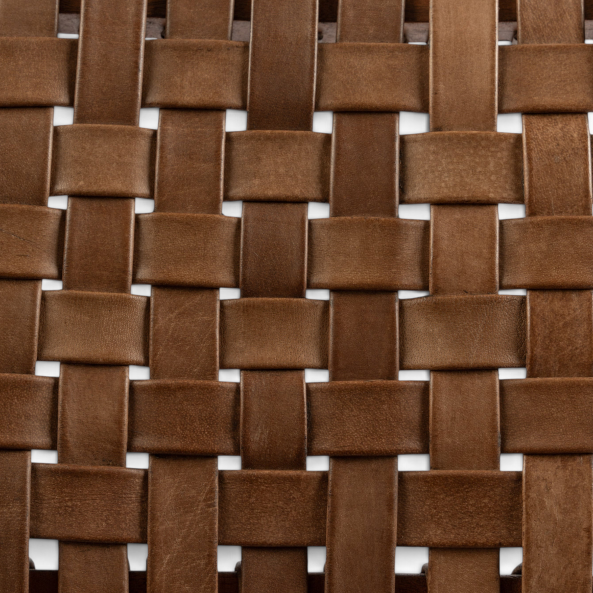 Close-up of The Well by BDAntiques dining chair seat featuring handwoven brown leather straps in a grid pattern.